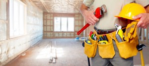 Builder handyman with construction tools.